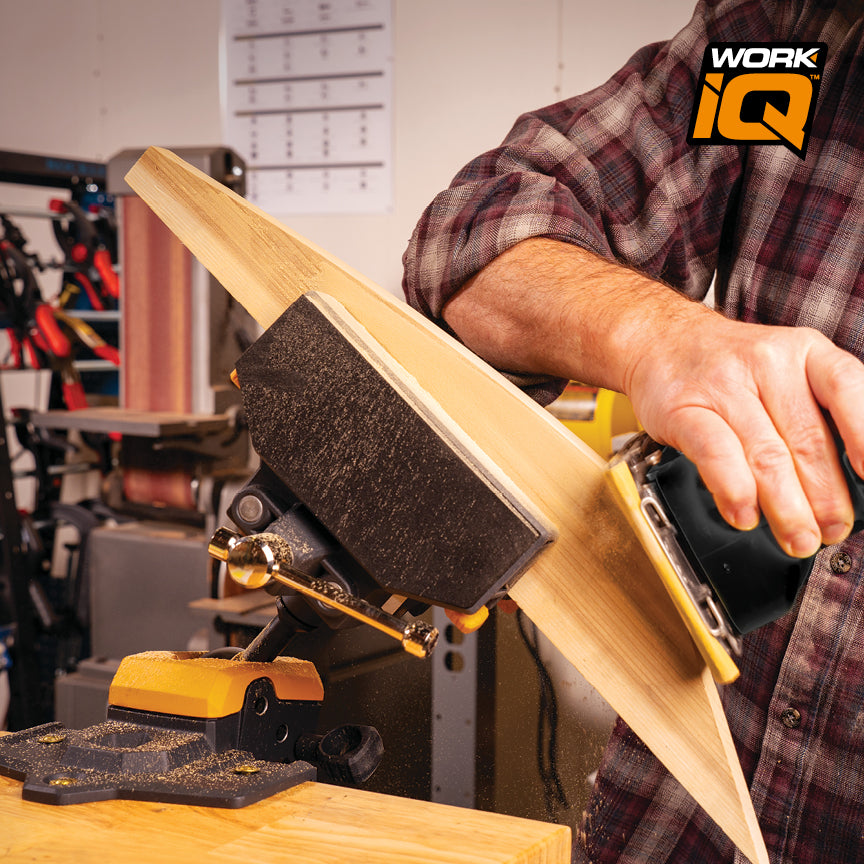 Person sanding a piece of wood held by an IQ Vise Jaw